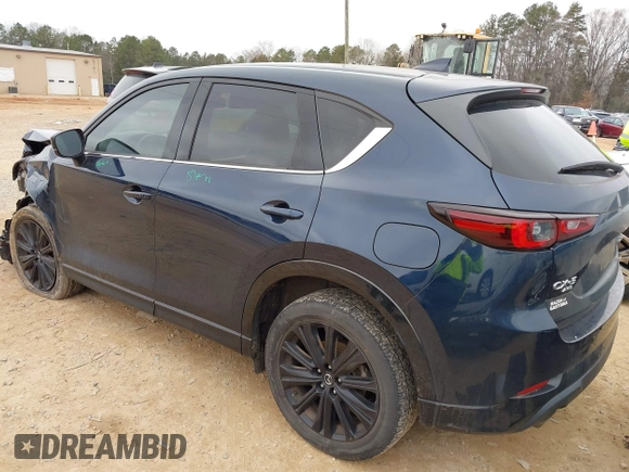 2022 Mazda CX-5 2.5 Turbo with VIN JM3KFBAY5N0521947, listed as a IAAI auction lot 41424202 with 43,961 mi miles and . Bid and sale history available at carsss.com. Image 3.