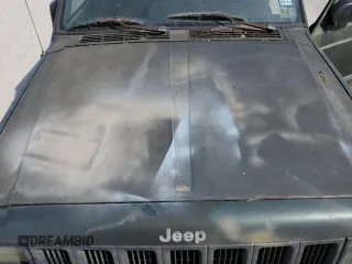 1997 Jeep Cherokee SE with VIN 1J4FT28SXVL540135, listed as a Copart auction lot 77043714 with 0 mi miles and Clean Title. Bid and sale history available at carsss.com. Image 12.