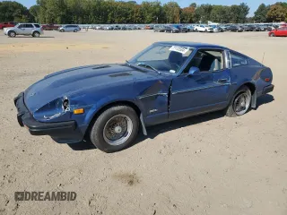 1979 Datsun 280ZX z VIN HS130133365, wystawiony jako Copart lot #77113584 z przebiegiem 99 721 mil mil oraz Szkody całkowita. Historia ofert i sprzedaży dostępna na DreamBid. Obrazek 1.