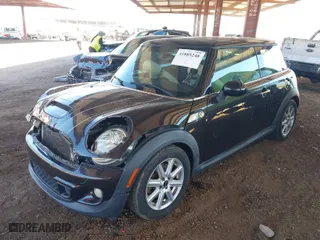 2013 MINI Cooper Hardtop S with VIN WMWSV3C5XDT480004, listed as a IAAI auction lot 41885248 with 148,419 mi miles. Bid and sale history available at carsss.com. Image 2.