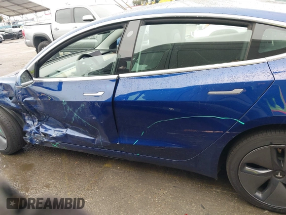 2020 Tesla Model 3 Standard Range Plus with VIN 5YJ3E1EAXLF644679, listed as a IAAI auction lot 41500595 with 53,726 mi miles and . Bid and sale history available at DreamBid. Image 14.
