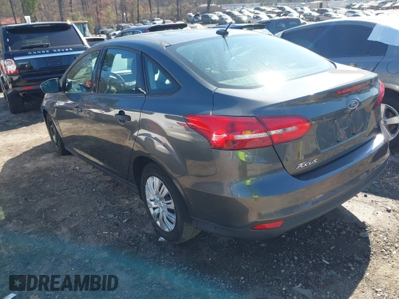 2017 Ford Focus S z VIN 1FADP3E29HL269607, wystawiony jako IAAI lot #41654836 z przebiegiem 101 645 mil mil oraz . Historia ofert i sprzedaży dostępna na DreamBid. Obrazek 3.