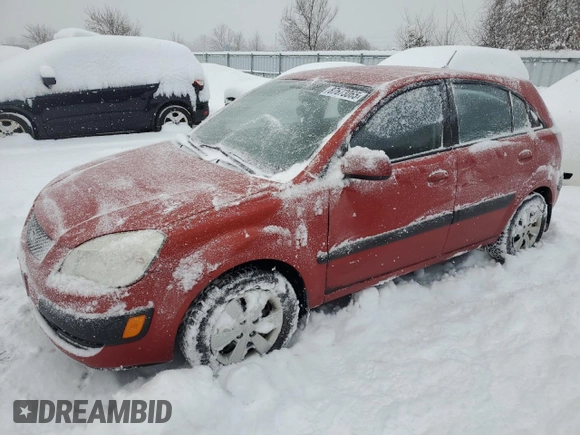 2009 Kia Rio LX with VIN KNADE243596480661, listed as a Copart auction lot 87673065 with 128,733 mi miles and Clean Title. Bid and sale history available at carsss.com. Image 1.