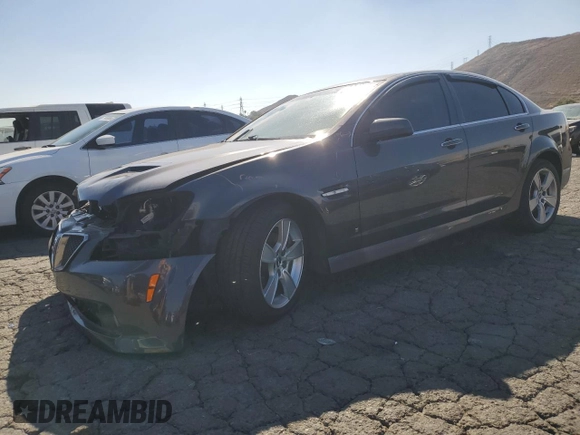 2009 Pontiac G8 GT with VIN 6G2EC57Y19L215718, listed as a Copart auction lot 77231714 with 57,515 mi miles and Salvage Title. Bid and sale history available at carsss.com. Image 1.