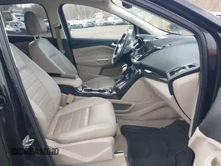 2014 Ford Escape Titanium with VIN 1FMCU9J98EUD73818, listed as a IAAI auction lot 42036442 with 129,794 mi miles. Bid and sale history available at carsss.com. Image 5.