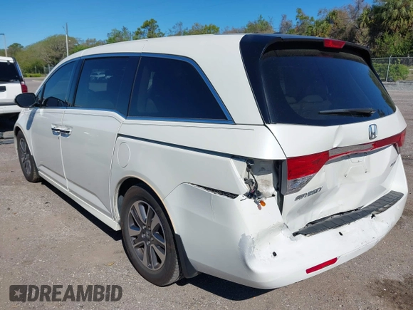 2015 Honda Odyssey Touring Elite with VIN 5FNRL5H96FB090702, listed as a IAAI auction lot 41825889 with 118,157 mi miles and . Bid and sale history available at DreamBid. Image 3.