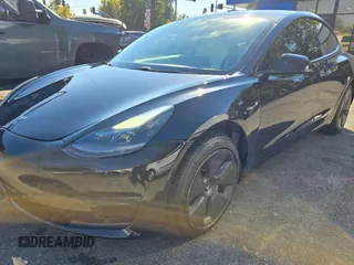 2021 Tesla Model 3 Standard Range Plus with VIN 5YJ3E1EA1MF871146, listed as a Copart auction lot 55633575 with 72,492 mi miles and Salvage Title. Bid and sale history available at DreamBid. Image 2.