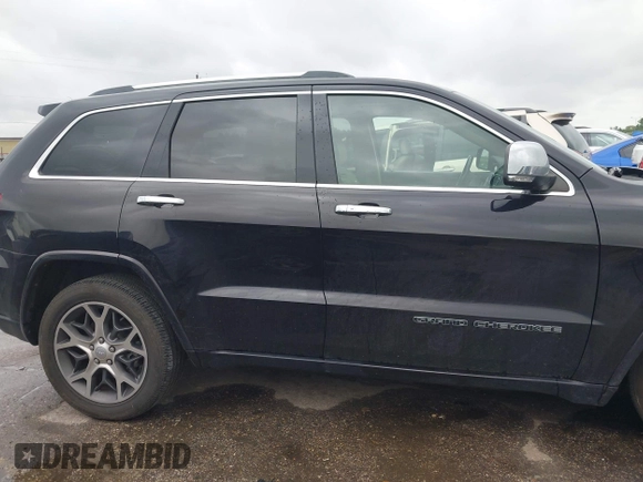 2021 Jeep Grand Cherokee Overland z VIN 1C4RJFCG4MC621214, wystawiony jako IAAI lot #42188010 z przebiegiem 15 559 mil mil oraz . Historia ofert i sprzedaży dostępna na DreamBid. Obrazek 14.