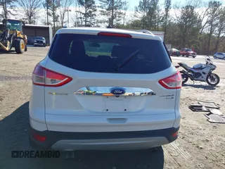 2014 Ford Escape Titanium with VIN 1FMCU9JX7EUD17335, listed as a IAAI auction lot 41302107 with 104,352 mi miles and . Bid and sale history available at DreamBid. Image 15.