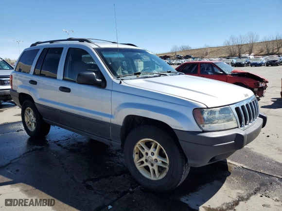 2003 Jeep Grand Cherokee Laredo with VIN 1J4GW48S13C556129, listed as a Copart auction lot 50389215 with 193,934 mi miles and Salvage Title. Bid and sale history available at carsss.com. Image 4.