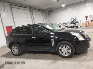 2015 Cadillac SRX with VIN 3GYFNAE36FS519604, listed as a IAAI auction lot 41215296 with 70,954 mi miles and . Bid and sale history available at DreamBid. Image 13.