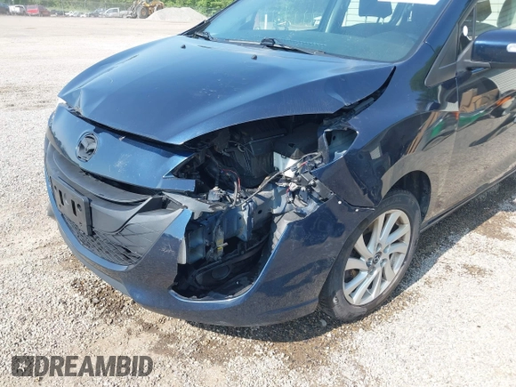 2015 Mazda 5 Sport z VIN JM1CW2BL9F0187973, wystawiony jako IAAI lot #42378711 z przebiegiem 97 543 mil mil oraz . Historia ofert i sprzedaży dostępna na DreamBid. Obrazek 6.