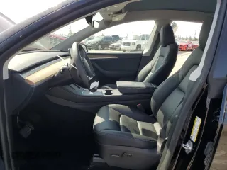 2024 Tesla Model Y Long Range with VIN 7SAYGDEE6RA219456, listed as a Copart auction lot 61855165 with 29,869 mi miles and Salvage title. Bid and sale history available at DreamBid. Image 7.