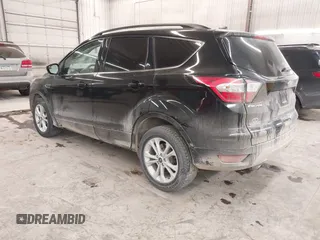 2018 Ford Escape SE z VIN 1FMCU9GD0JUC25636, wystawiony jako IAAI lot #40996760 z przebiegiem 70 097 mil mil oraz . Historia ofert i sprzedaży dostępna na DreamBid. Obrazek 3.