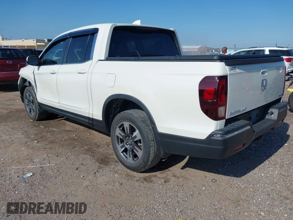 2017 Honda Ridgeline RTL-T z VIN 5FPYK3F69HB038048, wystawiony jako IAAI lot #42583177 z przebiegiem 183 564 mil mil oraz . Historia ofert i sprzedaży dostępna na DreamBid. Obrazek 3.