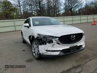 2021 Mazda CX-5 Signature with VIN JM3KFBEY5M0421694, listed as a Copart auction lot 85709714 with 28,126 mi miles and Salvage Title. Bid and sale history available at carsss.com. Image 10.