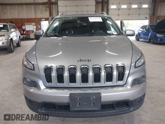 2016 Jeep Cherokee Latitude z VIN 1C4PJMCB9GW148882, wystawiony jako IAAI lot #42210237 z przebiegiem 124 441 mil mil oraz . Historia ofert i sprzedaży dostępna na DreamBid. Obrazek 12.