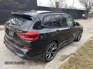 2021 BMW X3 M with VIN 5YMTS0C05M9G46973, listed as a IAAI auction lot 41334083 with 42,819 mi miles. Bid and sale history available at carsss.com. Image 4.