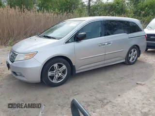 2012 Honda Odyssey Touring with VIN 5FNRL5H92CB055473, listed as a IAAI auction lot 42128601 with 163,901 mi miles. Bid and sale history available at carsss.com. Image 19.