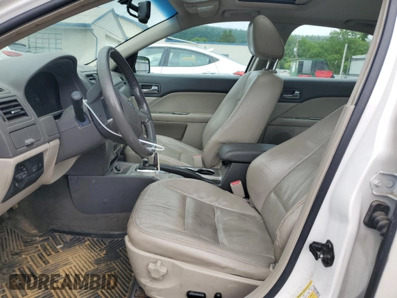 2010 Ford Fusion Hybrid with VIN 3FADP0L36AR203663, listed as a Copart auction lot 60310095 with 211,922 mi miles and Salvage title. Bid and sale history available at DreamBid. Image 7.