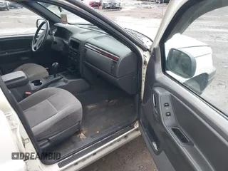 2000 Jeep Grand Cherokee Laredo z VIN 1J4G248S2YC339997, wystawiony jako IAAI lot #42395079 z przebiegiem 261 704 mil mil oraz . Historia ofert i sprzedaży dostępna na DreamBid. Obrazek 5.