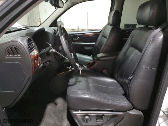 2005 GMC Envoy SLE with VIN 1GKDT13S452315816, listed as a Copart auction lot 52863805 with 128,922 mi miles and Salvage Title. Bid and sale history available at carsss.com. Image 7.