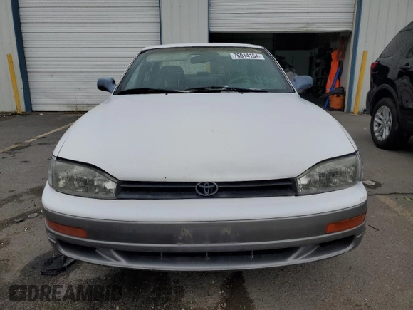 1994 Toyota Camry XLE with VIN JT2GK13E5R0008509, listed as a Copart auction lot 76014164 with 188,427 mi miles and Salvage Title. Bid and sale history available at carsss.com. Image 5.