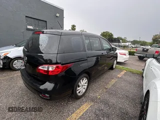 2015 Mazda 5 Sport z VIN JM1CW2BLXF0182880, wystawiony jako Copart lot #56959895 z przebiegiem 117 395 mil mil oraz Czysty tytuł • Clean title. Historia ofert i sprzedaży dostępna na DreamBid. Obrazek 4.