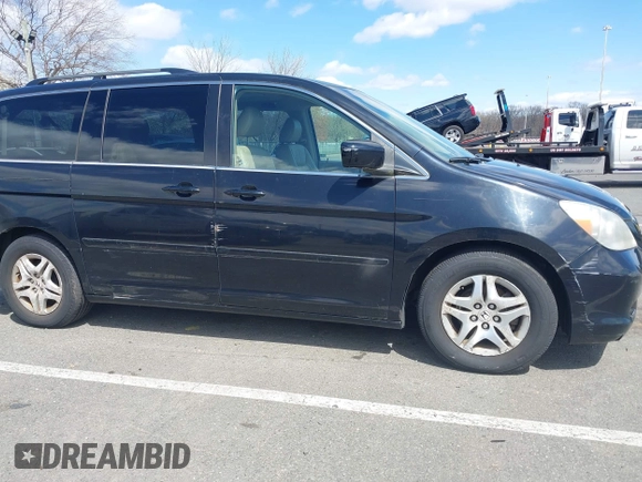 2006 Honda Odyssey EX-L z VIN 5FNRL387X6B055048, wystawiony jako IAAI lot #41974961 z przebiegiem 123 361 mil mil oraz . Historia ofert i sprzedaży dostępna na DreamBid. Obrazek 6.