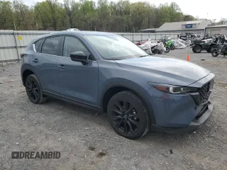2023 Mazda CX-5 S Carbon Edition z VIN JM3KFBCM9P0158890, wystawiony jako Copart lot #53839045 z przebiegiem 26 623 mil mil oraz Szkody całkowita. Historia ofert i sprzedaży dostępna na DreamBid. Obrazek 4.