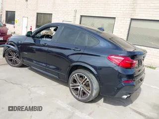 2015 BMW X4 xDrive35i with VIN 5UXXW5C50F0E87728, listed as a IAAI auction lot 41819628 with 136,042 mi miles and . Bid and sale history available at DreamBid. Image 3.