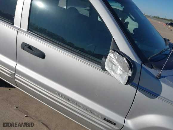 2004 Jeep Grand Cherokee Laredo with VIN 1J4GX48NX4C403936, listed as a IAAI auction lot 40855256 with 241,290 mi miles. Bid and sale history available at carsss.com. Image 12.