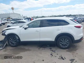 2022 Mazda CX-9 Touring with VIN JM3TCBCY0N0608052, listed as a IAAI auction lot 42027465 with 65,313 mi miles and . Bid and sale history available at DreamBid. Image 14.
