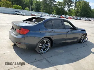 2012 BMW 3 Series 335i with VIN WBA3A9C5XCF474803, listed as a Copart auction lot 57940675 with 121,960 mi miles and Salvage title. Bid and sale history available at DreamBid. Image 3.