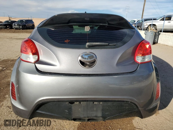2013 Hyundai Veloster w/Black Int z VIN KMHTC6AD0DU135773, wystawiony jako Copart lot #41367875 z przebiegiem 96 487 mil mil oraz Szkoda całkowita • Salvage title. Historia ofert i sprzedaży dostępna na DreamBid. Obrazek 6.
