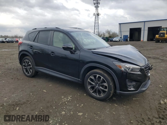 2016 Mazda CX-5 Grand Touring with VIN JM3KE4DY0G0727366, listed as a Copart auction lot 51682115 with 114,462 mi miles and Salvage Title. Bid and sale history available at carsss.com. Image 4.