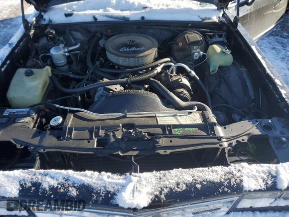1984 Chevrolet Monte Carlo z VIN 1G1AZ37H3EB102999, wystawiony jako Copart lot #87061824 z przebiegiem 271 202 mil mil oraz Szkody całkowita. Historia ofert i sprzedaży dostępna na DreamBid. Obrazek 11.