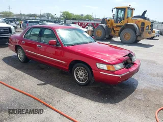 1999 Mercury Grand Marquis GS z VIN 2MEFM74W2XX635561, wystawiony jako IAAI lot #41982451 z przebiegiem 233 137 mil mil oraz . Historia ofert i sprzedaży dostępna na DreamBid. Obrazek 1.