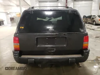 1998 Jeep Grand Cherokee Limited with VIN 1J4GZ88Z3WC165659, listed as a Copart auction lot 87527255 with 203,860 mi miles and Salvage Title. Bid and sale history available at carsss.com. Image 6.