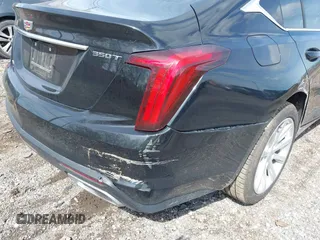 2021 Cadillac CT5 Luxury z VIN 1G6DX5RKXM0146235, wystawiony jako IAAI lot #42214676 z przebiegiem 72 847 mil mil oraz . Historia ofert i sprzedaży dostępna na DreamBid. Obrazek 17.