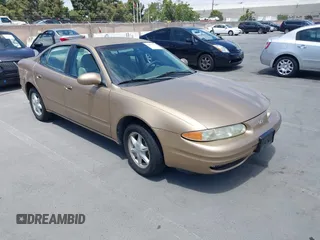 1999 Oldsmobile Alero GL z VIN 1G3NL52T1XC384073, wystawiony jako IAAI lot #42359330 z przebiegiem 177 869 mil mil oraz . Historia ofert i sprzedaży dostępna na DreamBid. Obrazek 1.