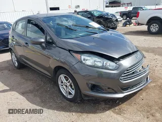 2018 Ford Fiesta SE z VIN 3FADP4EJXJM101086, wystawiony jako IAAI lot #41753388 z przebiegiem 67 286 mil mil oraz . Historia ofert i sprzedaży dostępna na DreamBid. Obrazek 1.