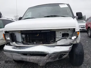 2004 Ford Econoline Cargo with VIN 1FTSS34L84HA56056, listed as a IAAI auction lot 41235862 with 215,095 mi miles and . Bid and sale history available at DreamBid. Image 12.