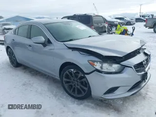 2014 Mazda Mazda6 i Touring with VIN JM1GJ1V62E1134427, listed as a IAAI auction lot 41550411 with 112,804 mi miles. Bid and sale history available at carsss.com. Image 1.