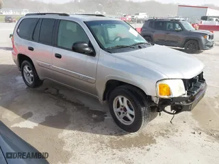 2004 GMC Envoy SLE with VIN 1GKDS13S642417698, listed as a IAAI auction lot 41843916 with 305,533 mi miles. Bid and sale history available at carsss.com. Image 1.