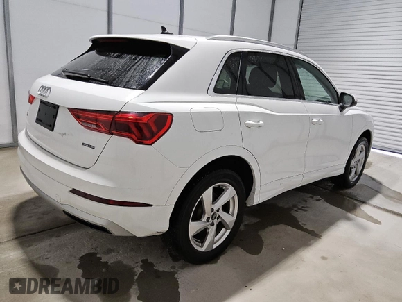 2021 Audi Q3 Premium with VIN WA1AUCF34M1090677, listed as a Copart auction lot 56111815 with 93,573 mi miles and Clean title. Bid and sale history available at DreamBid. Image 3.
