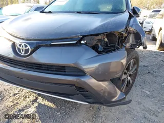 2016 Toyota RAV4 XLE with VIN 2T3WFREV0GW266691, listed as a IAAI auction lot 41804023 with 77,000 mi miles. Bid and sale history available at carsss.com. Image 6.