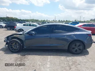 2023 Tesla Model 3 with VIN 5YJ3E1EAXPF575448, listed as a IAAI auction lot 42019288 with 33,859 mi miles and . Bid and sale history available at carsss.com. Image 15.