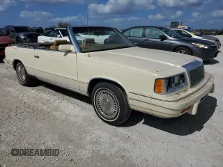 1986 Chrysler LeBaron z VIN 1C3BC55D0GG153072, wystawiony jako Copart lot #77865854 z przebiegiem 74 922 mil mil oraz Szkoda całkowita • Salvage title. Historia ofert i sprzedaży dostępna na DreamBid. Obrazek 4.