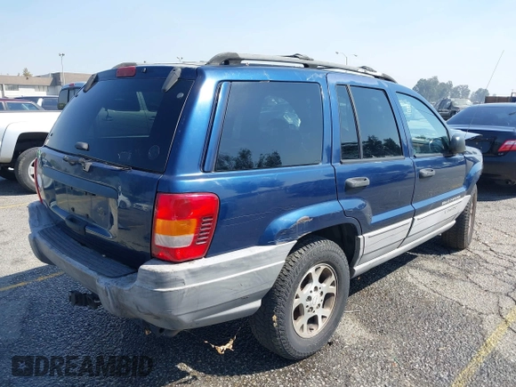 1999 Jeep Grand Cherokee Laredo z VIN 1J4G258S1XC787295, wystawiony jako IAAI lot #40450680 z przebiegiem Nie podano mil oraz . Historia ofert i sprzedaży dostępna na DreamBid. Obrazek 4.